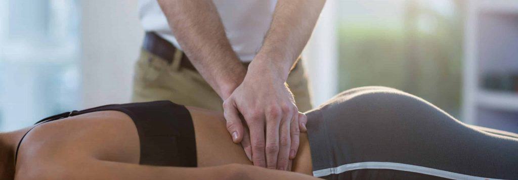 Physiotherapy hands on lumbar spine treatment for low back pain