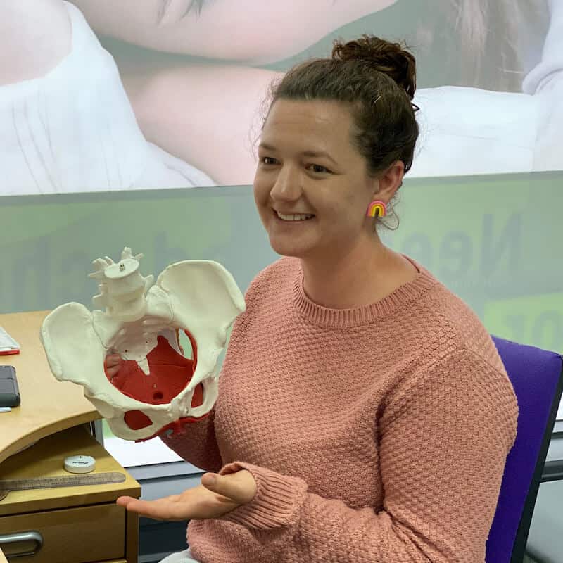 women’s health physio explaining pelvic floor symptoms during an appointment in fulham