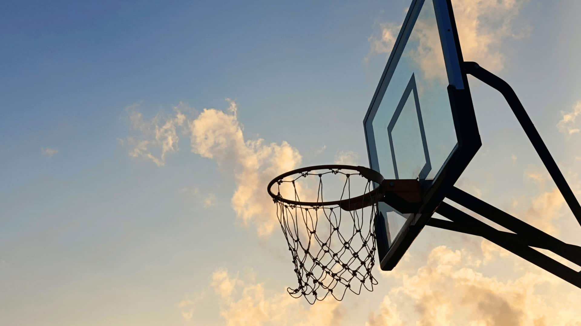 Basketball hoop with sky background