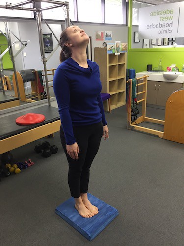 Balance challenge on blue mat to reduce chance of falls or balance problems